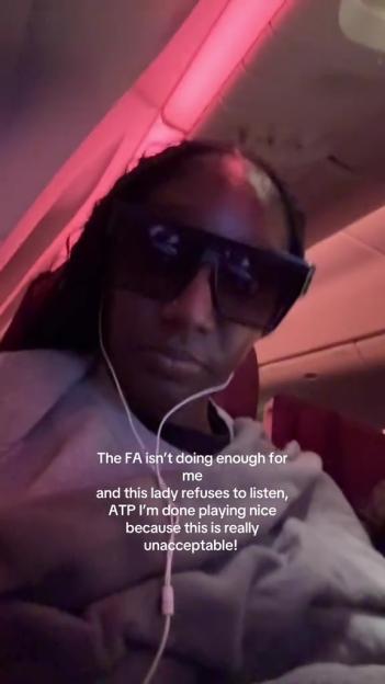 Woman on airplane complaining about disruptive passenger.