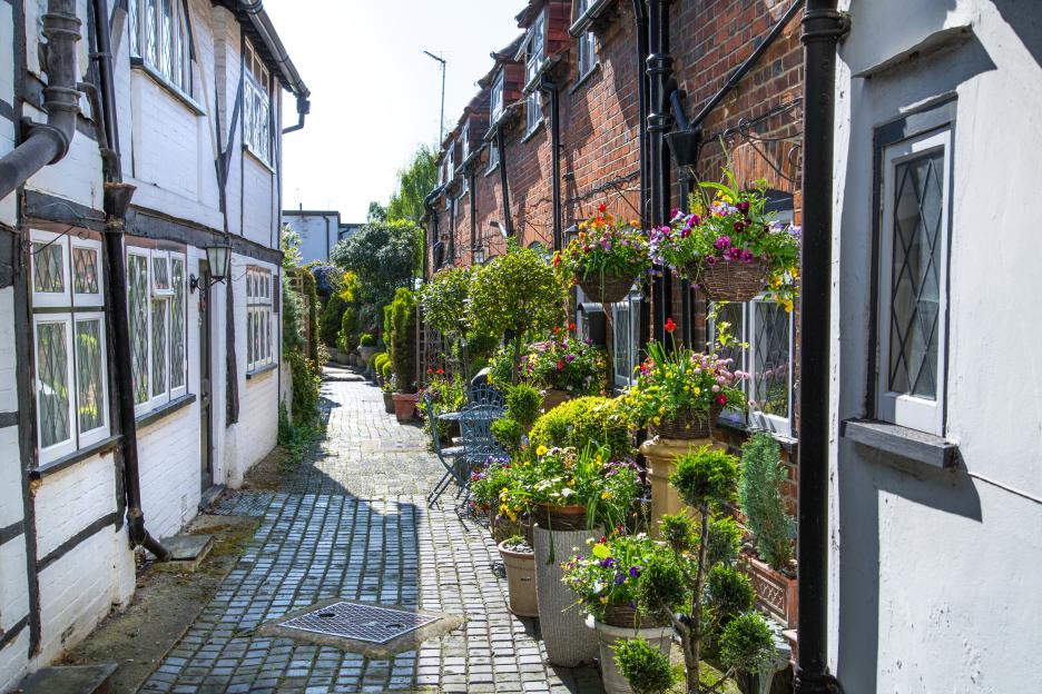 Little street in Old Eton with flower pots.