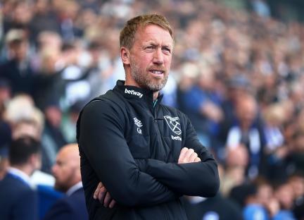 Graham Potter, manager of West Ham United, stands with arms crossed.