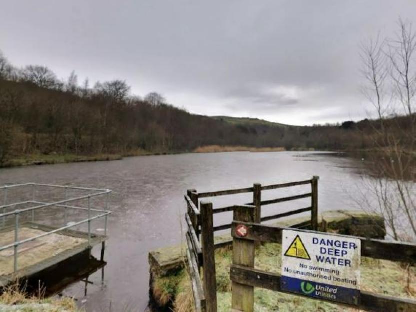 Reservoir with a "Danger: Deep Water" sign.