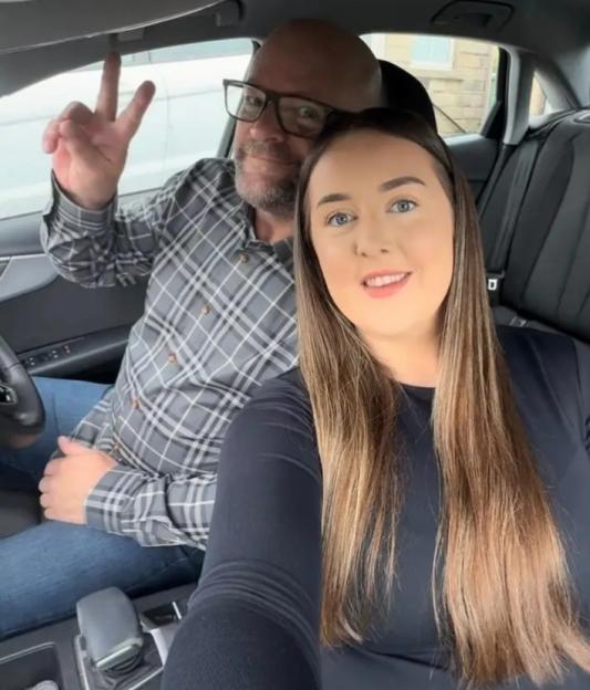 John Mitchell and Abi McMahon in a car.