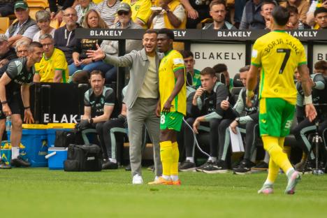 Norwich City interim head coach Jack Wilshere advising a player.