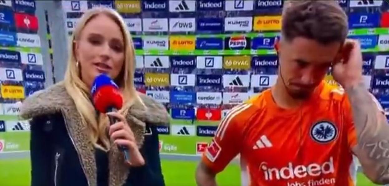 A Sky Sports reporter interviews a visibly upset soccer player after a 4-1 loss.