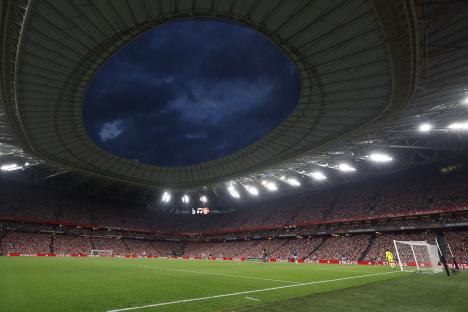 General view of a soccer match at a stadium.