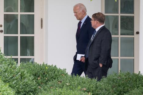 President Biden and his physician walking at the White House.