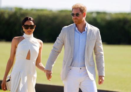 Prince Harry and Meghan, Duchess of Sussex, holding hands.