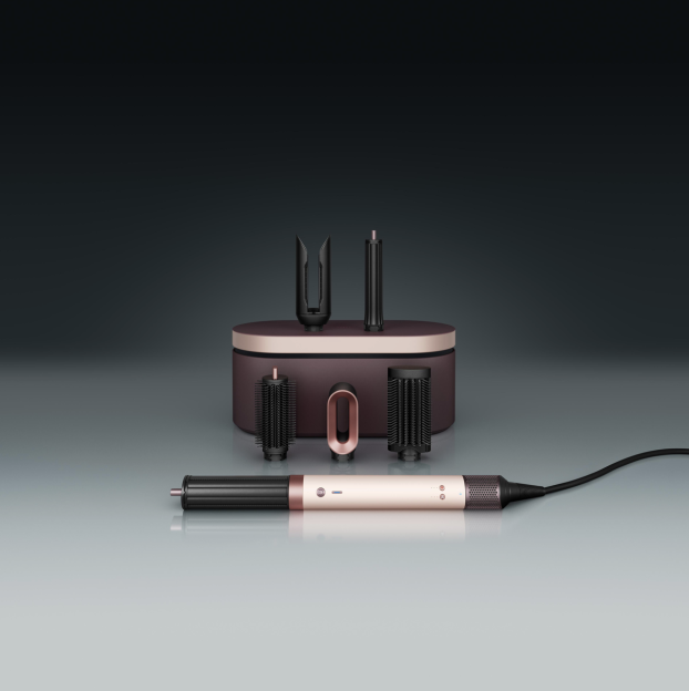 Dyson hair styling set with attachments and storage case.