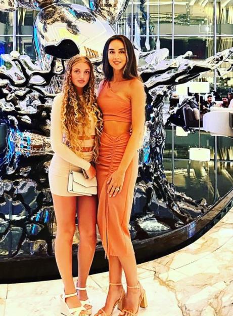 Peter Andres's daughter and wife at a celebratory event in Dubai.