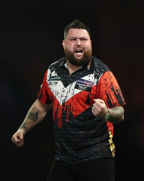 Michael Smith of England reacting during a darts match.