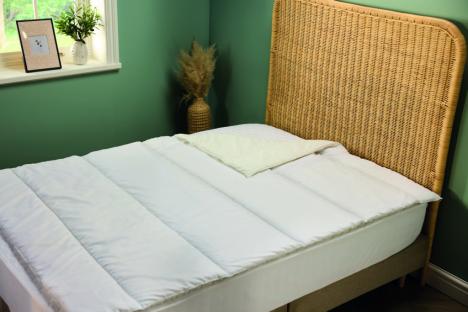 White anti-allergy bedding on a bed.