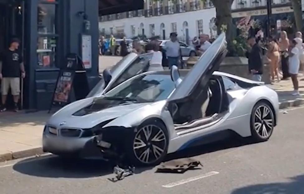 Moment street brawl erupts next to crashed £106k BMW as women yank each other’s hair in front of horrified onlookers