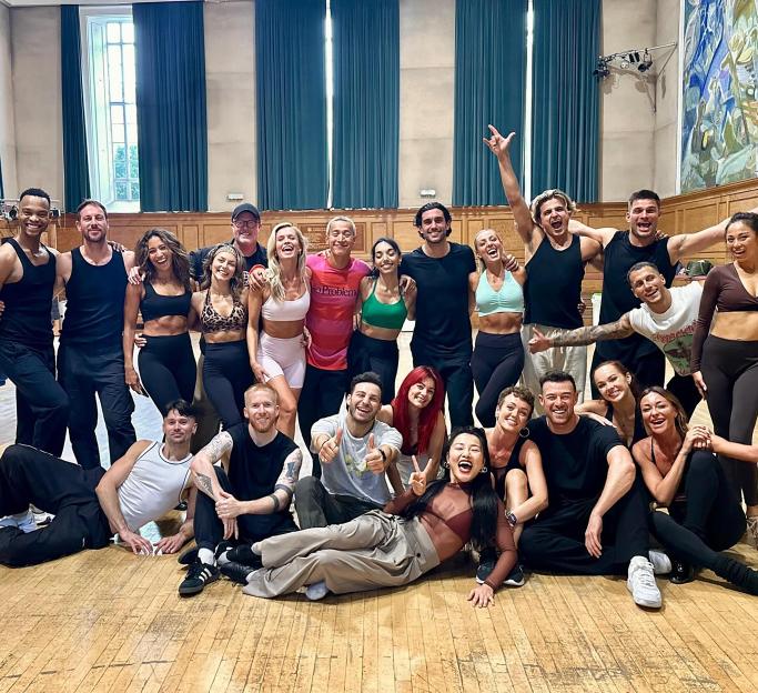 Group photo of dancers in a ballroom.