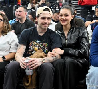 Brooklyn Beckham and Nicola Peltz at a basketball game.