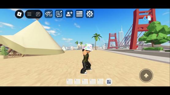 Roblox avatar on a beach near a bridge.