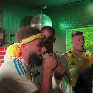 Leeds United players singing karaoke.