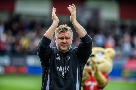 Karl Robinson, Salford City FC manager, applauding fans.