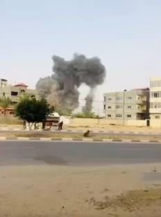 Smoke billows from a damaged hospital in Khan Younis, Gaza Strip.