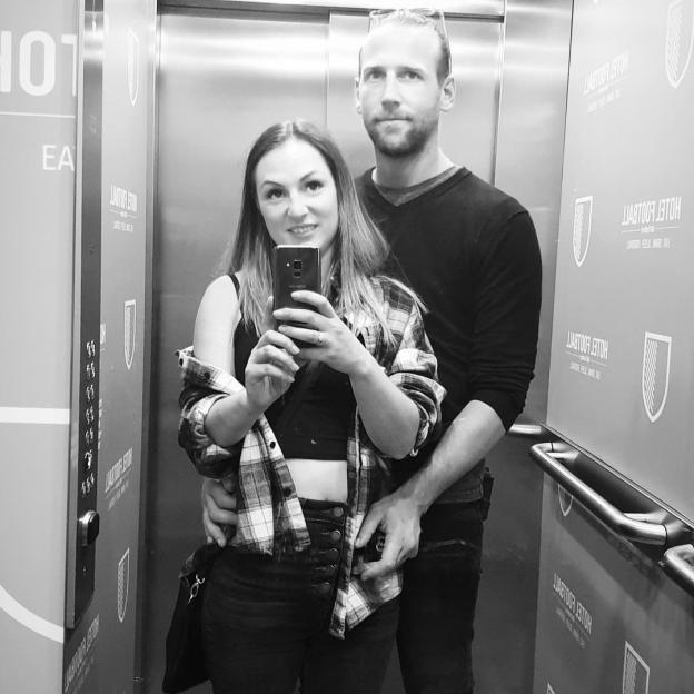 Black and white selfie of a couple in an elevator.
