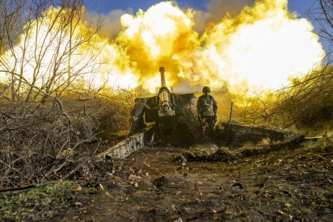 (FILES) A Ukrainian soldier of an artillery unit fires towards Russian positions outside Bakhmut on November 8, 2022, amid the Russian invasion of Ukraine. (Photo by Bulent KILIC / AFP) (Photo by BULENT KILIC/AFP via Getty Images)