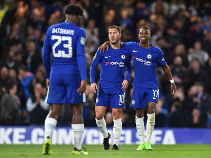 Chelsea soccer players celebrating a goal.