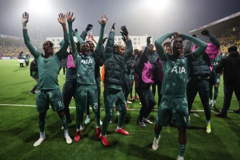 Tottenham Hotspur players celebrating after a match.