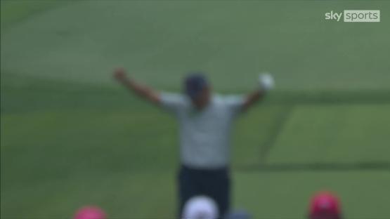 Blurry image of Si Woo Kim celebrating a hole-in-one.