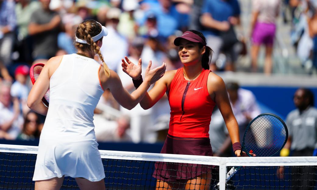 Emma Raducanu and Elena Rybakina at the net after a tennis match.
