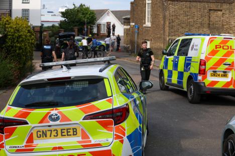 Police cars at the scene of a recovery operation.