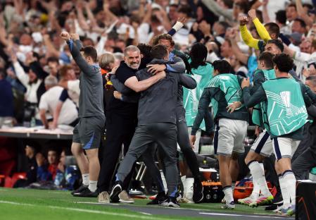 Tottenham Hotspur manager Ange Postecoglou celebrates with his team.