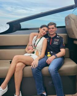 Max Verstappen and Kelly Piquet sitting together on a boat.