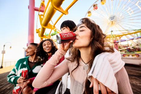 Under Embargo Until Wednesday 26th of March 17.00 GMT, 26th March 2025, LONDON : Coca-Cola is bringing back its legendary "Share a Coke" campaign, offering fresh brand experiences and inviting a new generation to experience the magic of personalised connection. In 2013, the brand launched this first-of-its-kind campaign in the UK in which you could find your name in place of the logo an industry-first in personalisation. Once again you will now be able to share a Coke with friends to celebrate your friendships and create memories that will last a lifetime., Did you know that 72 per cent of Gen Z seek authenticity and want to connect with real people in everything they do*? In a world where interactions online can feel momentary, sharing a Coke offers a tangible way to show you care. With this being the first time Gen Z will experience Share A Coke, the brands unique customisation platform will offer even more names to choose from, be it a nickname, surname or personal term of endearment, and the ability to add your own personal touch. If you cant find your name in store, simply scan the QR code (on pack or point of sale), which will take you to the Share a Coke digital hub. Users can create a truly unique Coca-Cola pack to express appreciation for friends, family, and loved ones. It's a simple gesture that can strengthen connections., Alongside the much-loved name personalisations available, for the first time, Brits will be able to choose from a range of other nicknames and phrases around friendship, such as My Bestie, My Bae, My Mate, My Fam and My Day One., To celebrate the relaunch of Share a Coke, the brand has created the Share a Coke Memory Maker an online digital experience that allows you to create memes with your friends and family while enjoying a refreshing Coca-Cola. Partnering with famous creators to create unique templates, you can make your own personalised videos using your own content., So how can you join the fun? Look for personalised Coca-Cola packs in store from May 1st and get ready to share the magic with your mates., Elodie Peribere Senior Marketing Director UK & Ireland at Coca-Cola says: Share a Coke is about celebrating the magic of human connections, one personalised Coca-Cola pack at a time. Returning after its initial popularity in 2013, were excited to be able to give consumers more ways to connect over a Coca-Cola. Given the nations fondness for nicknames, Brits have the chance to personalise a can with a surname, term of affection or nickname of choice, meaning people can create something totally unique to them.", Follow Coca-Cola GB on social media be the first to hear when cans will be on shelf from May ., #ShareACoke #CocaCola #RealMagic