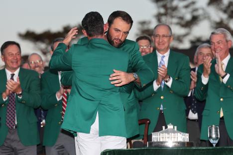 Scottie Scheffler and Rory McIlroy embracing at the Green Jacket Ceremony.