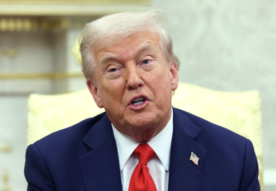 President Donald Trump speaking during a meeting in the Oval Office.