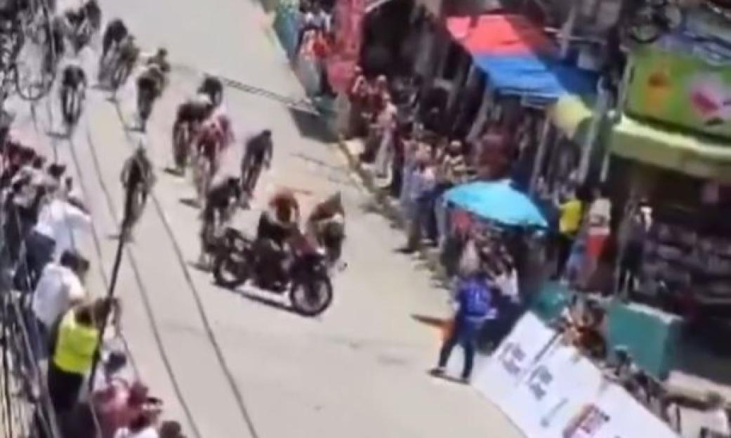 Horror moment crowds scream as cyclists sent flying when POLICE OFFICER on motorbike cuts them up during sprint finish