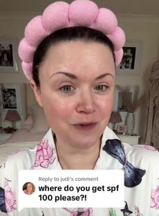 Woman in pink headband and Wizard of Oz pajamas responds to a comment asking where to get SPF 100.
