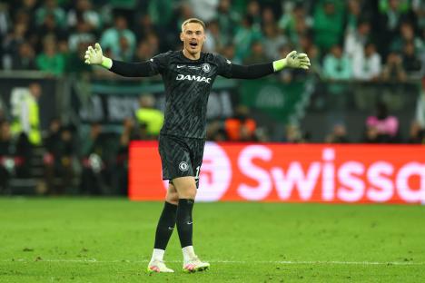 Filip Jorgensen of Chelsea reacting during a soccer game.