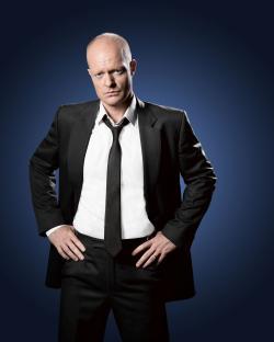 Portrait of Jake Wood in a suit.