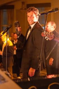 James Argent performing at a charity event.