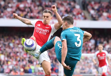 Soccer players competing for the ball.