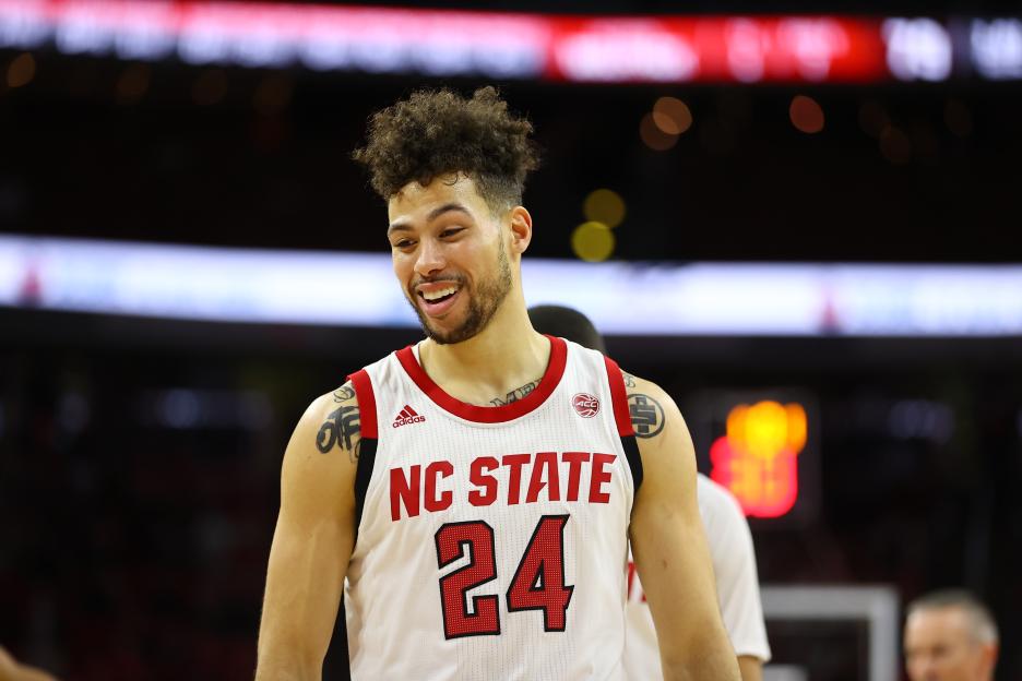 NC State Wolfpack guard Devon Daniels (#24) smiling.