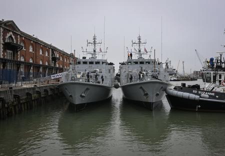 Two former Royal Navy mine sweepers docked at Portsmouth Naval Base.