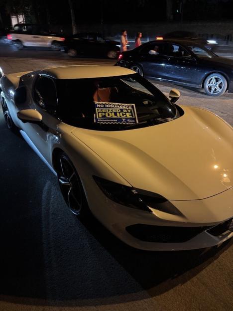 White Lamborghini seized by police for lack of insurance.