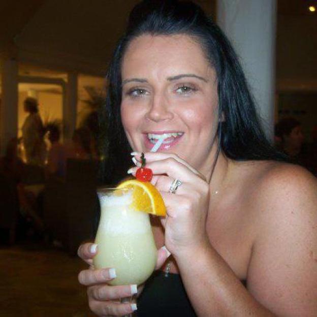Woman drinking a cocktail.