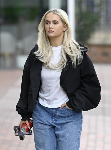 Molly Mae looking glum while out and about.