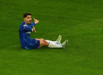 Chelsea's Pedro Neto reacting on the soccer field.