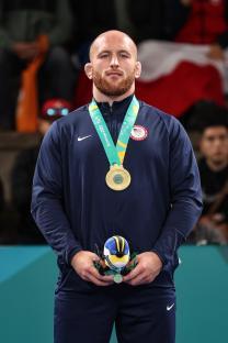 Kyle Snyder of Team USA on a podium with a gold medal.