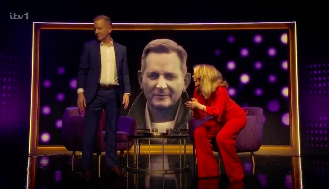 Jeremy Kyle and Kate Garraway on a talk show.