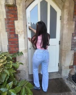 Woman unlocking door to new home.