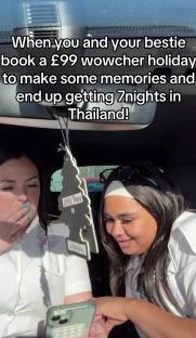 Two women in a car excitedly look at a phone, having won a 7-night trip to Thailand for £99.