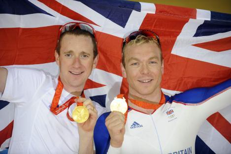 Team GB cyclists with gold medals at the Beijing Olympics.